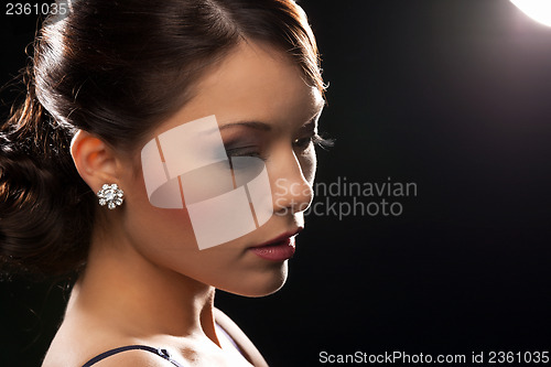 Image of woman with diamond earrings