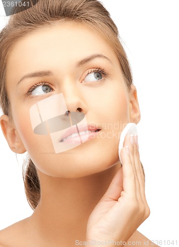 Image of beautiful woman with cotton pad