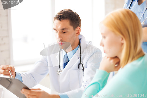 Image of male doctor with patient