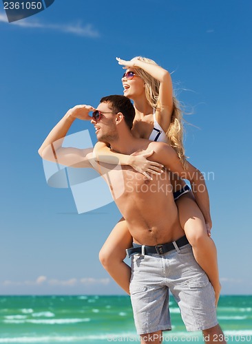 Image of couple having fun on the beach