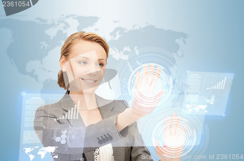 Image of businesswoman working with virtual screens