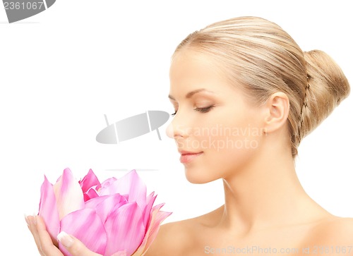 Image of lovely woman with lotos flower