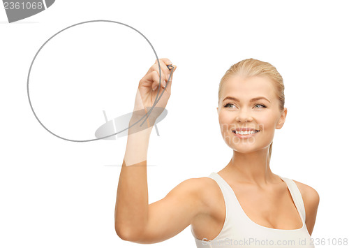 Image of woman drawing round shape