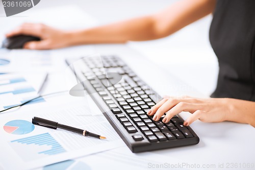Image of woman hands typing on keyboard