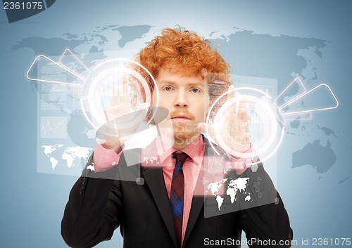 Image of businessman touching virtual screen