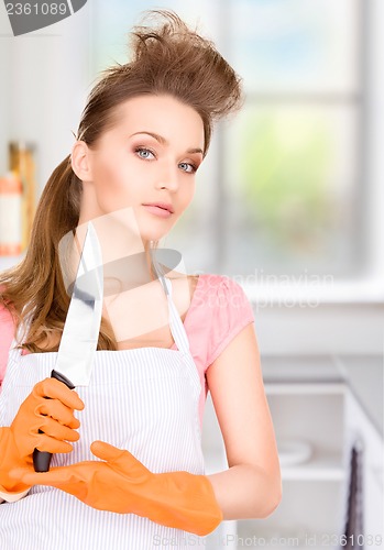 Image of housewife with big knife