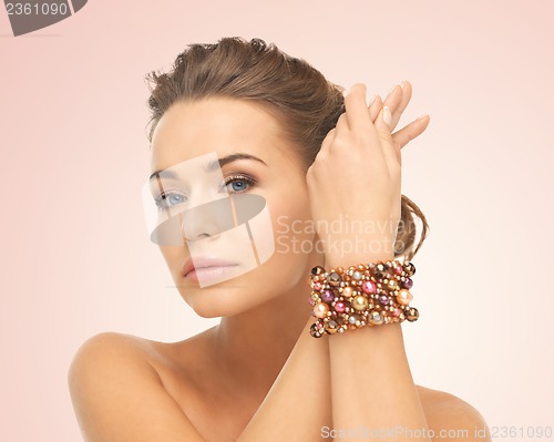 Image of woman wearing bracelet with beads
