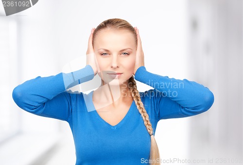 Image of woman with hands on ears