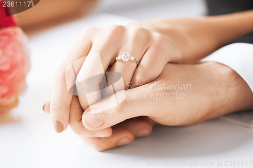 Image of man and woman with wedding ring