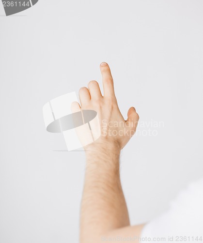 Image of man hand pointing at something