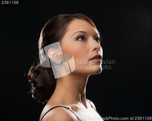 Image of woman with diamond earrings