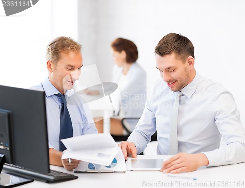 Image of businessmen with notebook and tablet pc