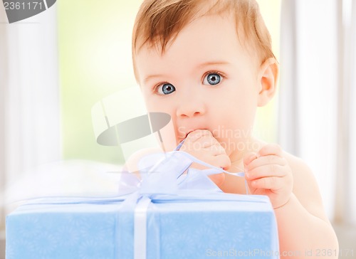 Image of happy child with gift box