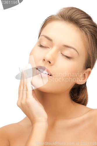 Image of beautiful woman with cotton pad