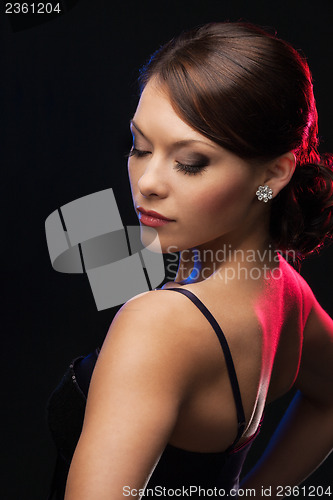 Image of woman with diamond earrings