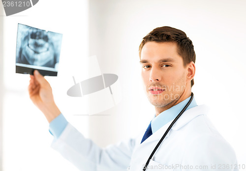 Image of male doctor or dentist with x-ray