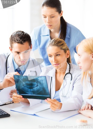 Image of young group of doctors looking at x-ray