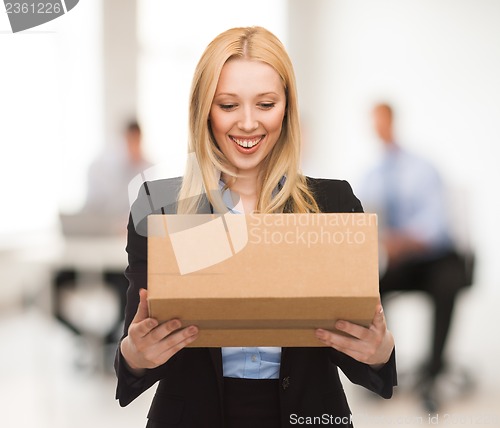 Image of businesswoman with cardboard box