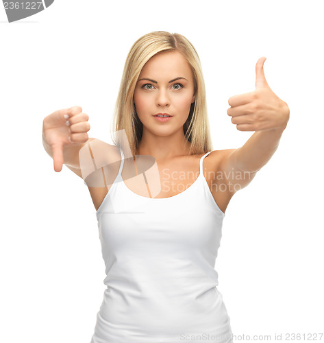 Image of woman with thumbs up and down