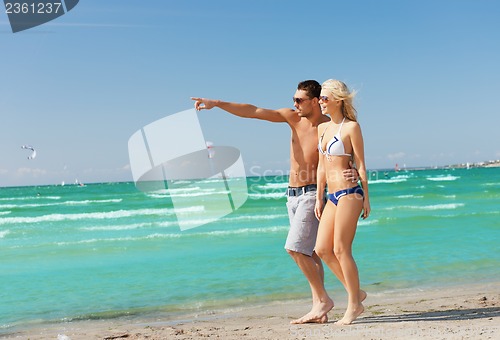 Image of couple walking on the beach