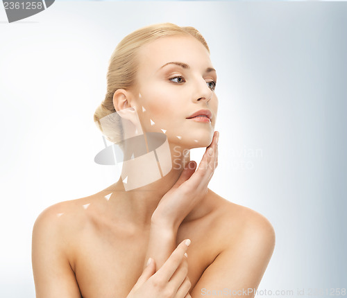 Image of face and hands of beautiful woman