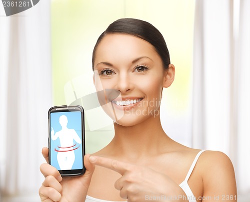 Image of woman pointing at smartphone with application