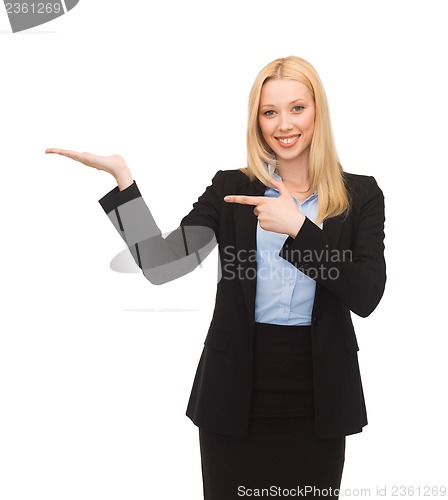 Image of man showing something imaginary on her hand