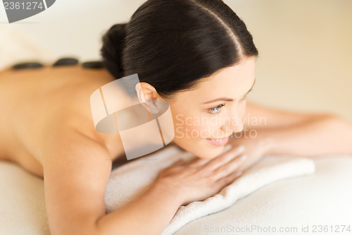 Image of woman in spa with hot stones