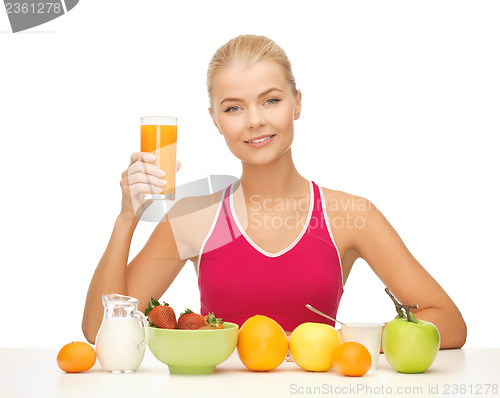 Image of young woman eating healthy breakfast