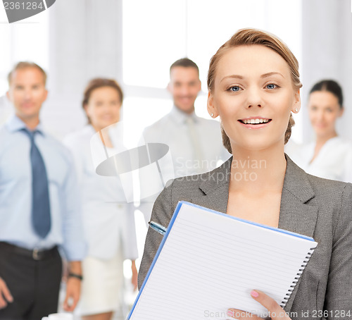 Image of happy woman with big notepad