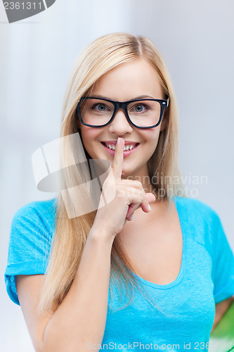 Image of woman with finger on her lips