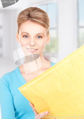 Image of businesswoman with parcel