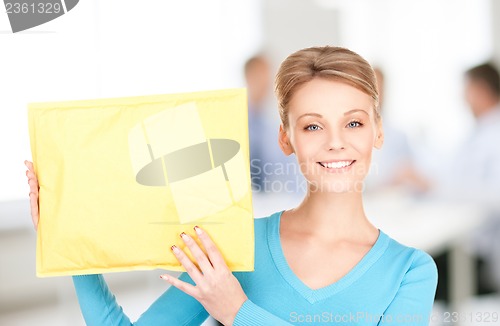 Image of businesswoman with parcel