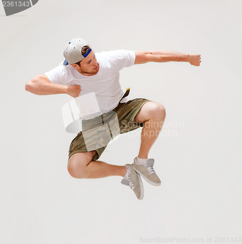 Image of male dancer jumping in the air