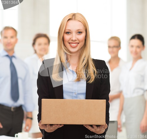 Image of businesswoman delivering cardboard box