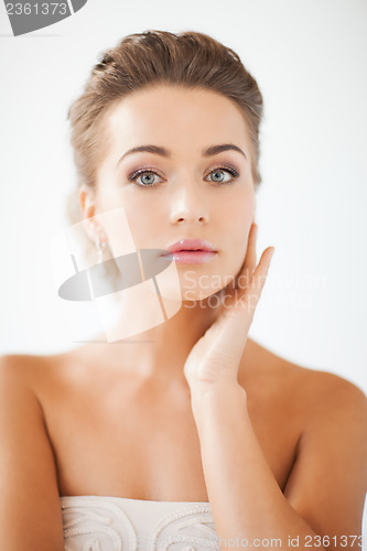 Image of woman with diamond earrings
