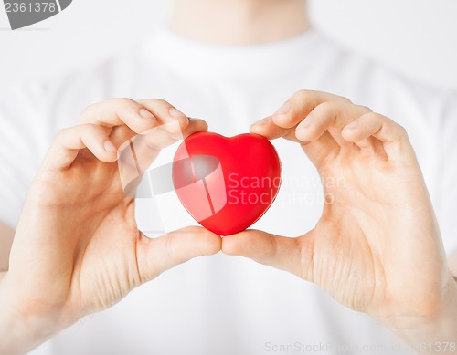 Image of man hands with heart