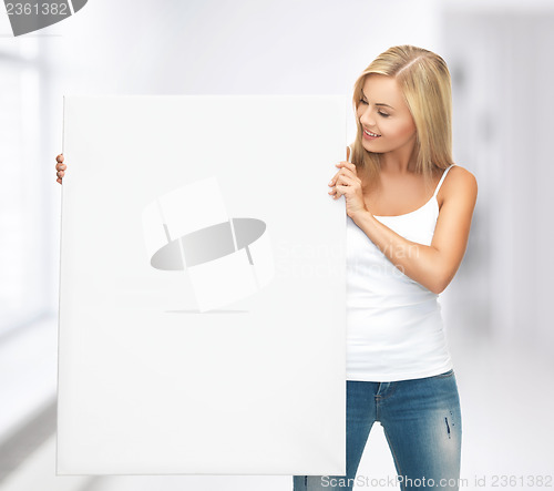 Image of woman with white blank board