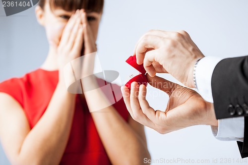 Image of couple with wedding ring and gift box