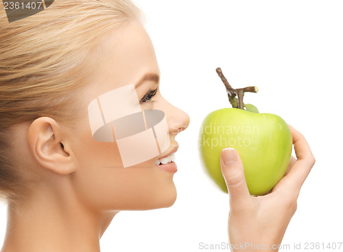 Image of woman smelling apple