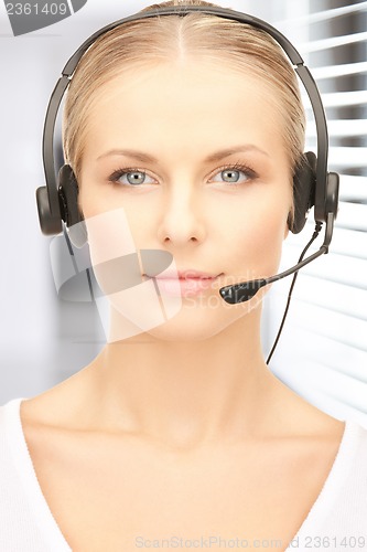 Image of friendly female helpline operator