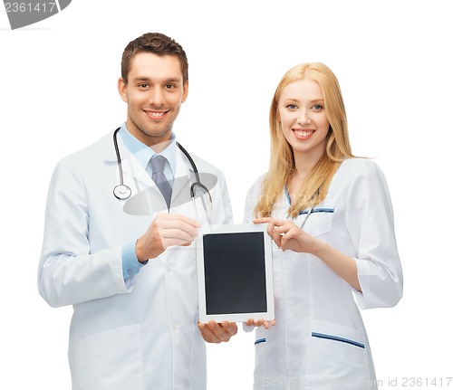 Image of young doctors showing tablet pc