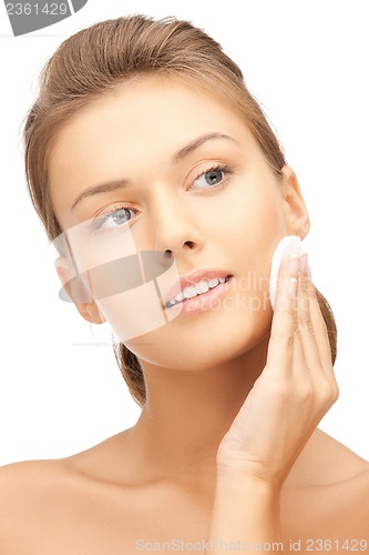 Image of beautiful woman with cotton pad