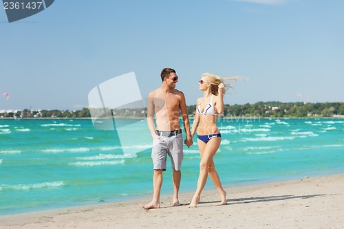 Image of couple walking on the beach