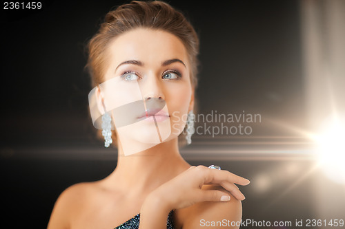 Image of woman with diamond earrings