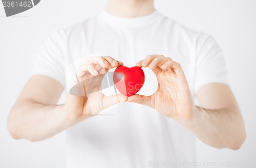 Image of man hands with heart