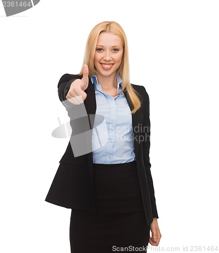 Image of young businesswoman with thumbs up