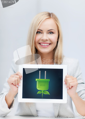 Image of woman with tablet pc with electrical eco plug