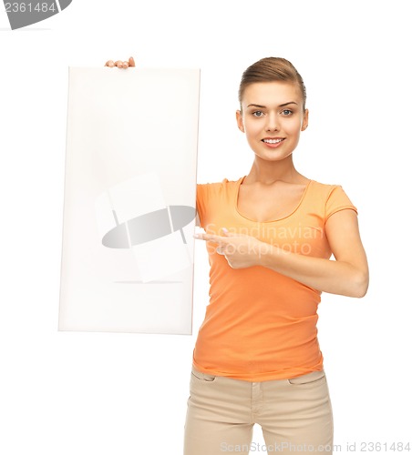 Image of woman pointing at white blank board