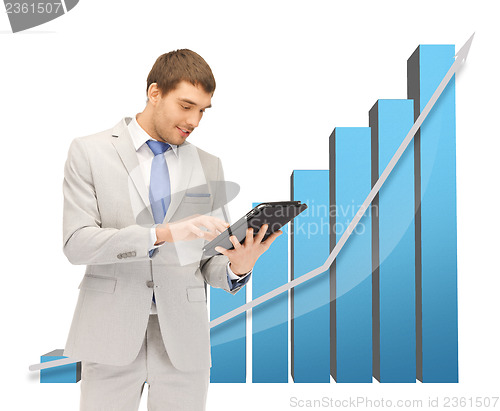 Image of businessman with big 3d chart